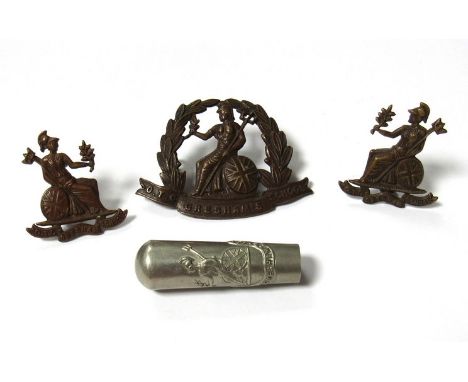 A quantity of Norfolk Regiment O.T.C Gresham's School items: cap badge, two collar badges and swagger stick top 