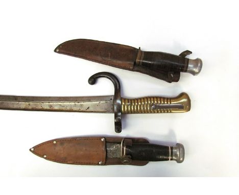 A French Chassepot bayonet, brass ribbed grip, together with two 1940's/50's sheath knives (3) 