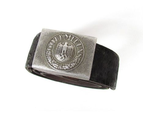 A Third Reich era German army belt with alloy buckle bearing eagle and swastika 'Gott Mit Uns'.  Acquired in Nuremberg 