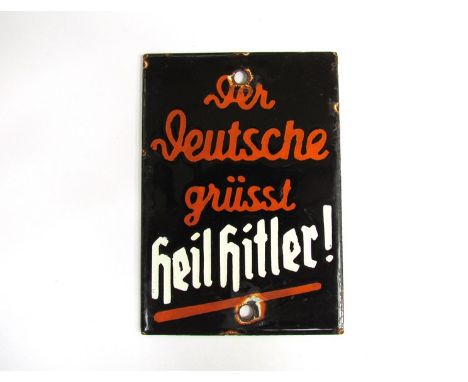 A Third Reich era German "Der Deutsche Grusst Heil Hitler" door plate. In enamel on metal with white and orange lettering on 