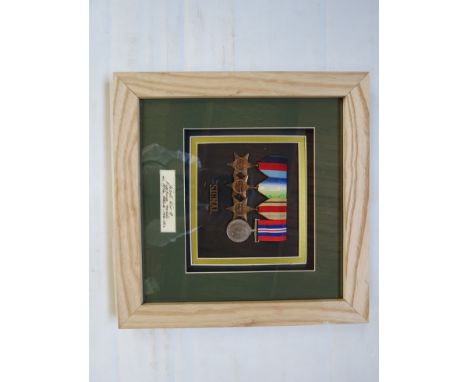 A WWI medal group of four consisting of 1939-45 Atlantic and Africa stars, war medal to CPL K. WILSON Royal Signals, framed a