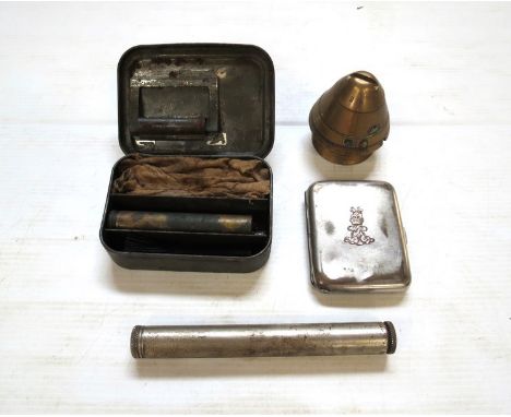 A British military cigarette case bearing lion and King's crown crest, shell timer fuse and two gun cleaners including Thomps