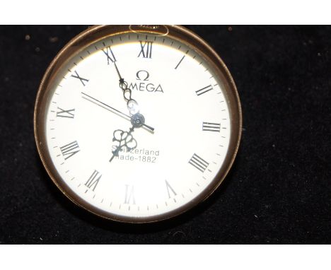 Brass &amp; glass bubble clock states Omega on the face