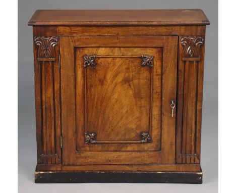 A William IV mahogany dwarf cabinet, fitted with a single shelf enclosed by a fielded panel door, with applied mouldings and 