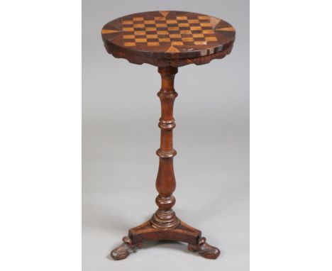 A 19th century rosewood, mahogany and satin birch pedestal table with chessboard top, shaped frieze and turned column, the tr