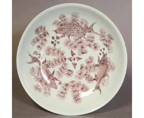 A Chinese porcelain pale celadon &amp; under glazed copper-red “three fish” shallow bowl, depicted swimming amongst weeds abo