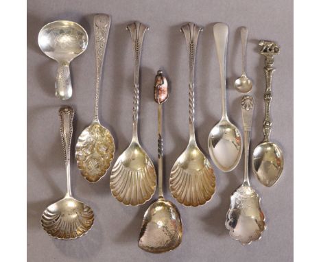 A pair of late Victorian silver serving spoons with oval shell bowls, Sheffield 1894; two preserve spoons; a sifter ladle; a 