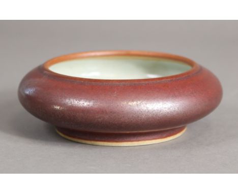 A Chinese porcelain peachbloom-glazed brush washer with pale celadon interior, on short foot with Qianlong seal mark in under