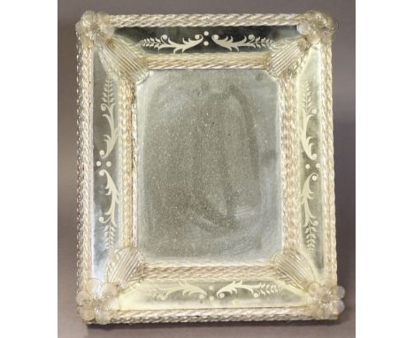 A mid-20th century Venetian glass table mirror, the plain rectangular plate with etched &amp; moulded glass foliate borders, 