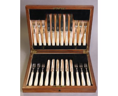 A set of twelve pairs of silver dessert knives &amp; forks with mother-of-pearl handles, Sheffield 1935-6, by Isaac Ellis &am