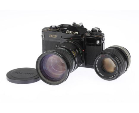 A Canon EF 35mm SLR Camera and Two Lenses black, 1973-78, date code 1977, serial no.398728 with a FDn f/3.5 35-105mm zoom len