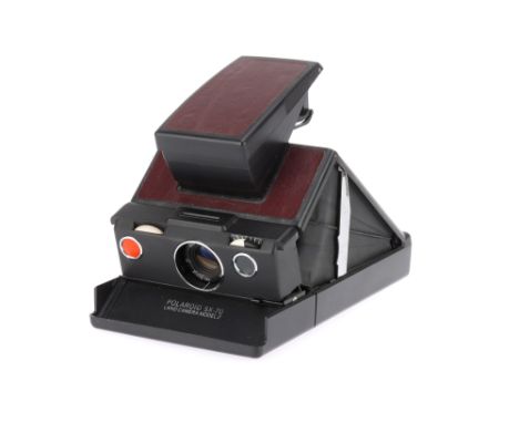 A Polaroid SX-70 Land Model 2 Instant Folding SLR Camera 1974-77, dark maroon, body F-G, lens G, untested