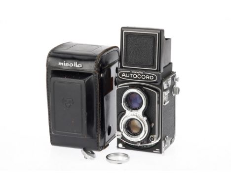 A Minolta Autocord Medium Format TLR Camera black, 1955-65, serial no.401447, with a Rokkor f/3.5 75mm lens, shutter working,