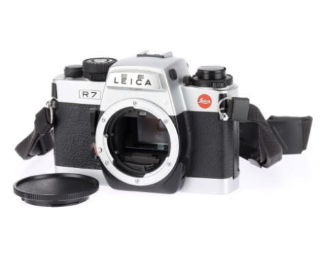 A Leica R7 35mm SLR Camera Body silver finish, 1992, serial no.1919927, viewfinder lights up, shutter working in manual, othe