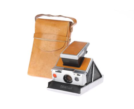 A Polaroid SX-70 Land Instant Folding SLR Camera 1972-77, light tan, loaded with part-used expired film, body G, lens G, with