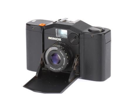 A Minox 35 GL Compact 35mm Camera black, circa 1979, 4021943, with a Color-Minotar f/2.8 35mm lens, untested, body G, lens G