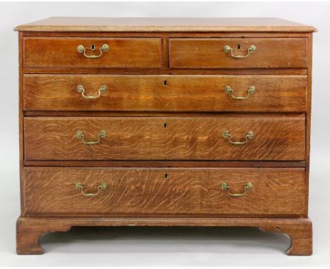 A George III oak chest, the moulded rectangular top above two short and three long drawers, on bracket feet, 104cm wide x 49c