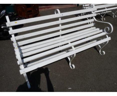 White painted wooden slatted scrolled metal garden bench