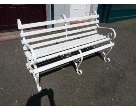 White painted wooden slatted scrolled metal garden bench