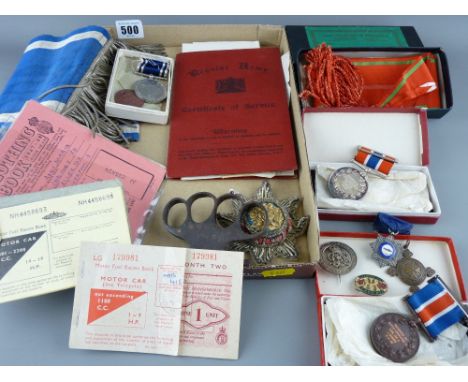 Liverpool City Police awards and medals along with other badges and pendant, bullion star, steel knuckleduster and wartime ra