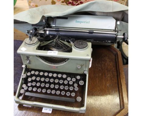 An Imperial vintage typewriter with original cover
