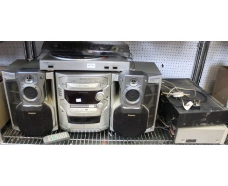A shelf containing a music centre &amp; similar items