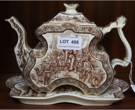 A Victorian serpentine rectangular form teapot and matching stand,&nbsp; decorated with elephants, figures, and hunting dogs,