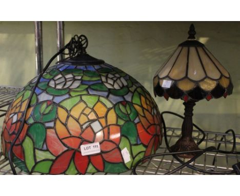 A Tiffany style ceiling hanging light shade with a similar table lamp
Condition: Large hanging one: 42cm in diameter, little 