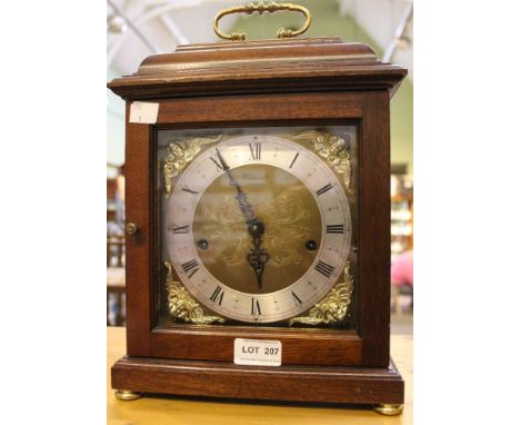 Comitti London - An oak cased mantle clock