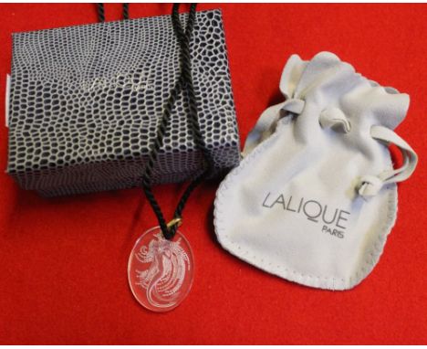 A millennium Lalique clear and frosted glass intaglio pendant, depicting a Naide water sprite. Set in original pale grey pouc