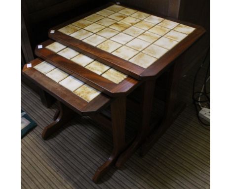 A G-Plan nest of three tables, with inset tile tops