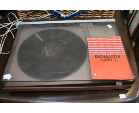 A Bang &amp; Olufsen Beomaster 2004-2 record player
Condition: appears to have been dropped at some point, mechanism out of a