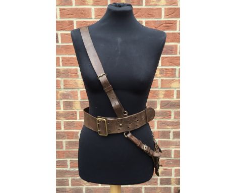 A leather Sam Browne officer’s belt, cross strap, and sword hanger, likely of the interwar period. Nice chestnut coloured pol