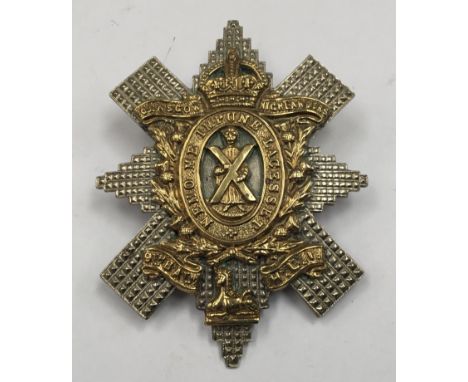 A scarce WWI era 9th Battalion Highland Light Infantry bi metal cap badge, copper lugs at east, west position to the reverse,
