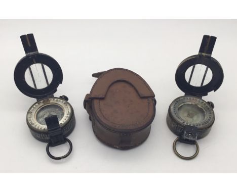 2 x WW2 era British Mark III compasses, one complete with its original leather case. Both by ‘T.G.Co Ltd London’, with one da