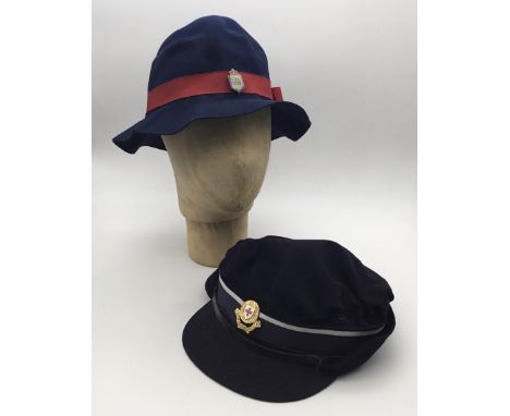 A scarce WW2 era Civil Nursing Reserve felt hat, fitted with a red grosgrain ribbon hatband, side bow, and a white metal and 