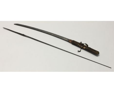 A vintage Japanese Wakizashi. Slightly curved blade, with triangular section spine, and a copper habaki. Tortoiseshell and wo