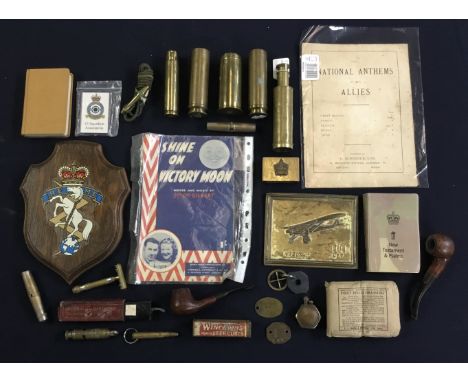 A selection of WW1, WW2, and later miscellaneous items. To include: brass shell cases, a WW1 Canadian trench art brass matchb