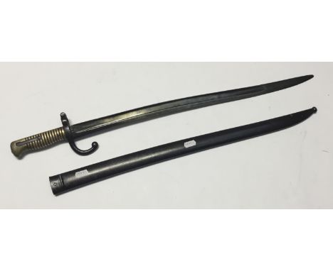 French Chassepot Bayonet with scabbard. With the usual ribbed brass grip with integral push button release catch. Yataghan st