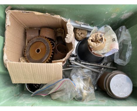 A large scale, probably lorry, hub, with Iveco packaging, a large scale piston and other mechanical parts. 