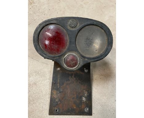 A Lucas 'owl light' rear lamp on bracket. 