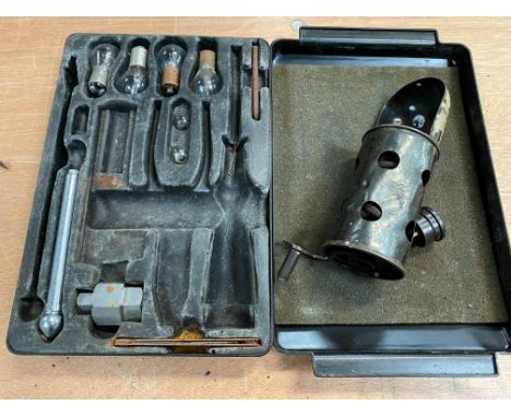 A Bentley T1 partial tool kit plus a 1920s brass inspection lamp. 