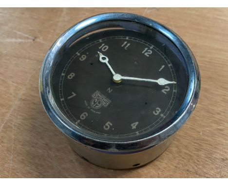 A Smiths black faced eight day car clock. 