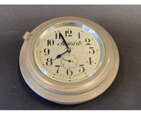 A good quality Stewart nickel plated eight day rim wind car clock with secondary dial. 