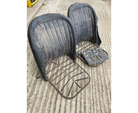 A pair of bracket seats, frames only with spring bases, 19" widest across back. 