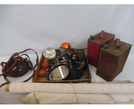 An autojumbler's lot of various parts including indicators, door handles, a Butler spot lamp, two petrol cans, various trim e