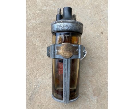 A Runbaken oil filled coil with bracket. 