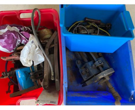 A quantity of tools and a bench vice. 