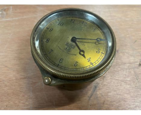 A Smiths brass faced rim wind clock. 