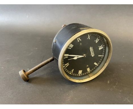 A Jaeger black faced eight day car clock, bottom wind. 